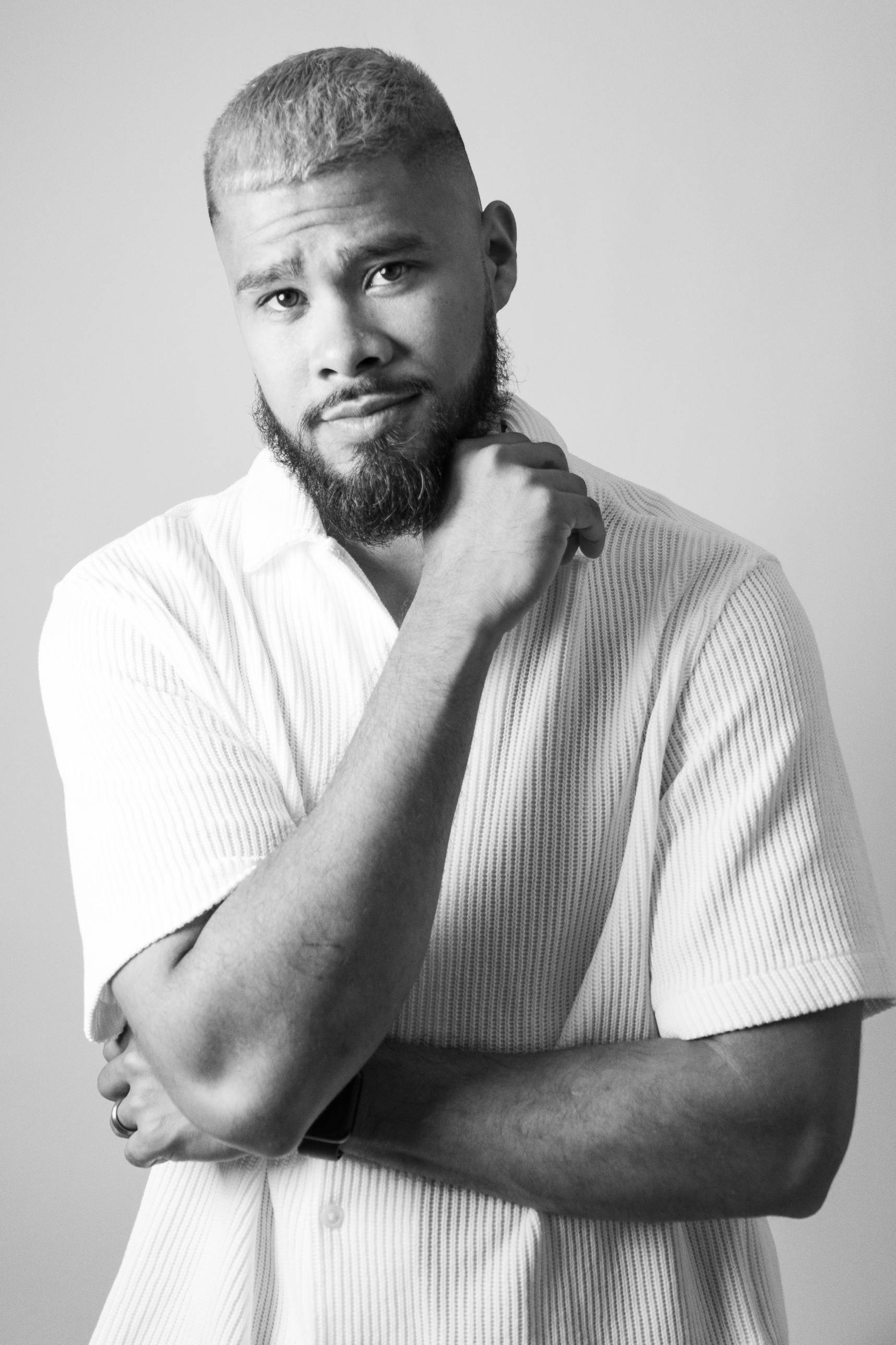 Black and white portrait, hand on chin
